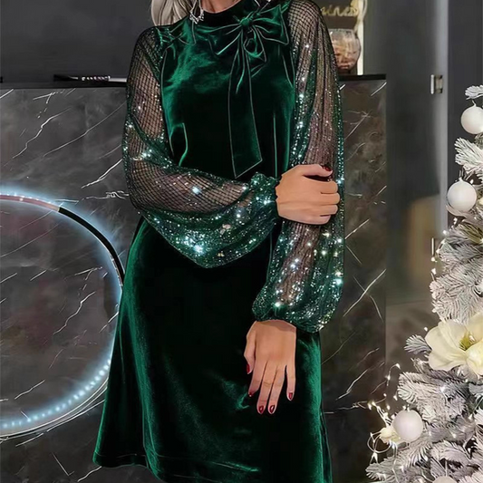 Women’s dress with sequins and a bow at the neckline