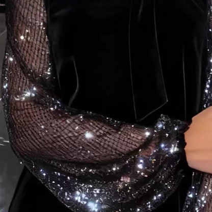 Women’s dress with sequins and a bow at the neckline